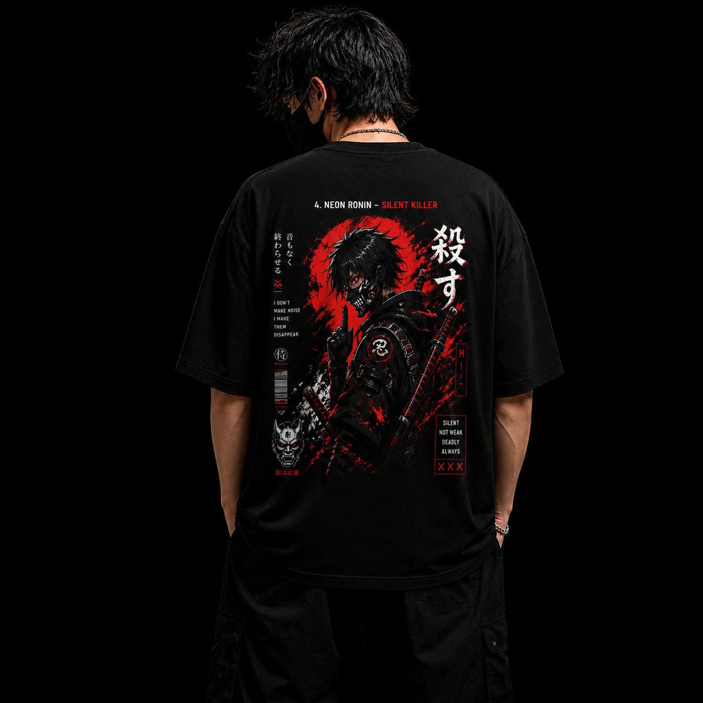 Person wearing a black t-shirt with a graphic design on the back against a black background