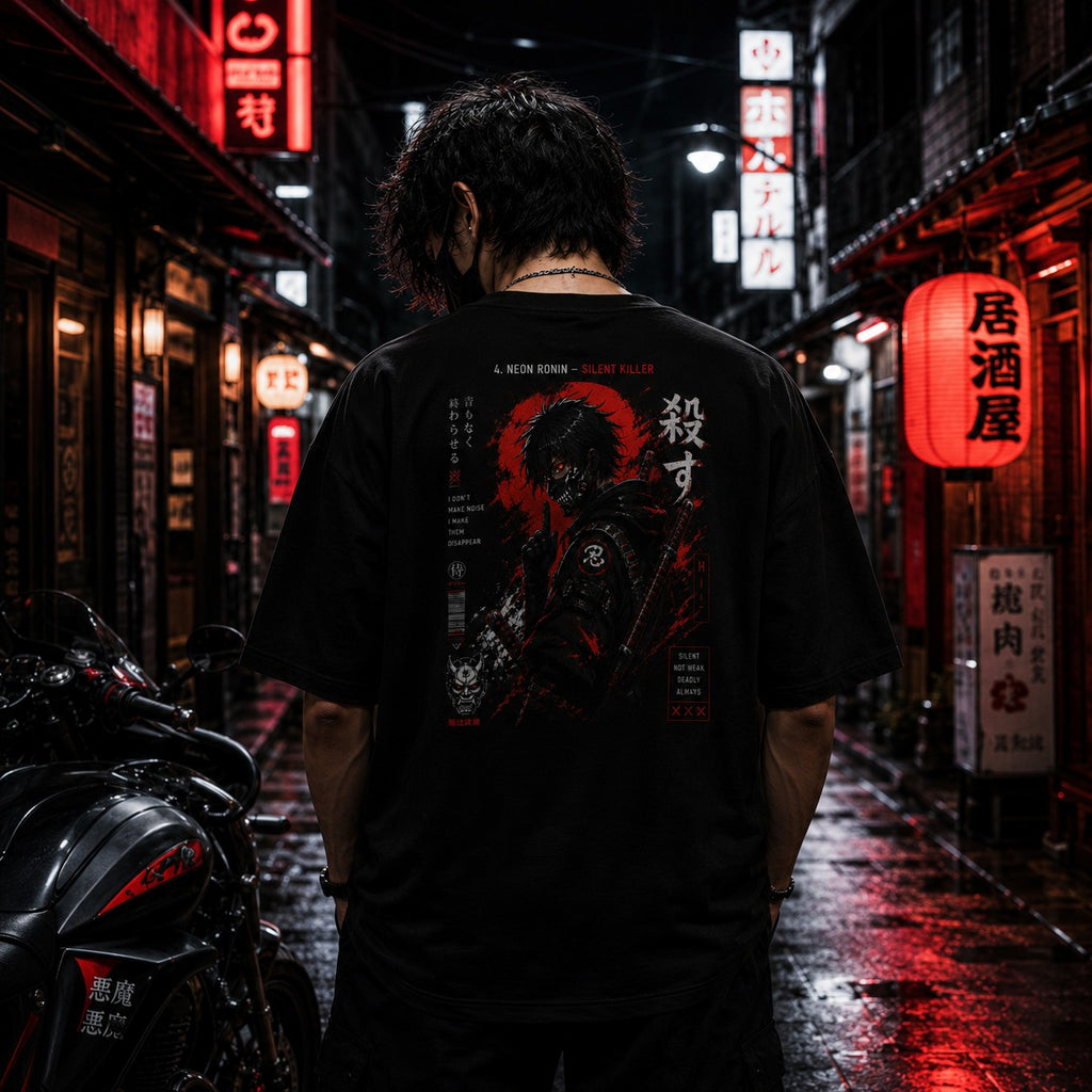Person wearing a black t-shirt with a graphic design in a neon-lit street at night