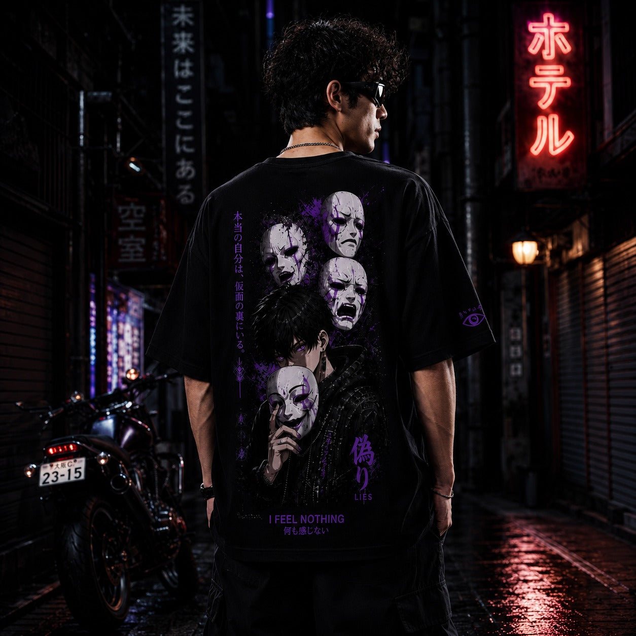 Person wearing a black t-shirt with graphic designs and text in a neon-lit urban setting