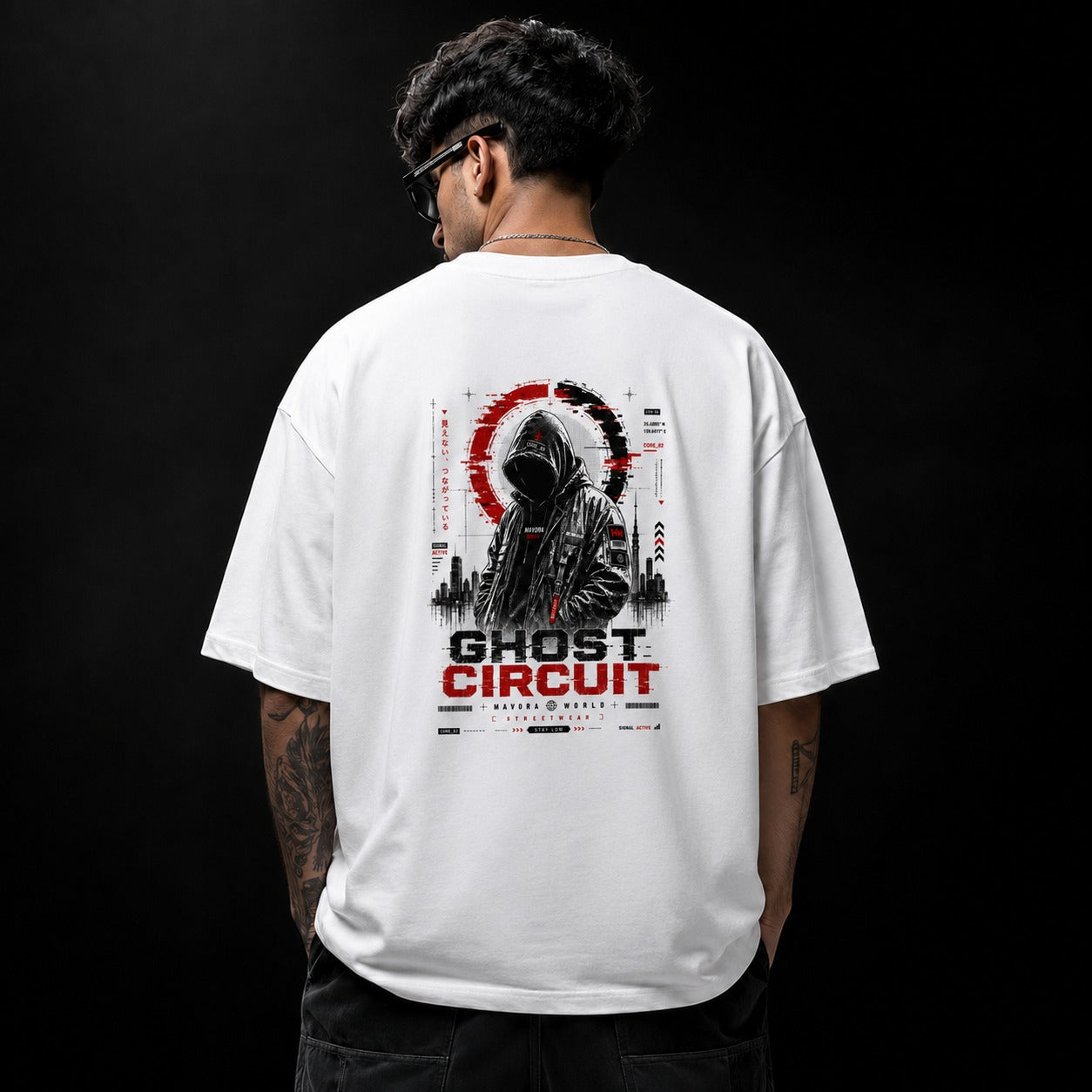 Person wearing a white t-shirt with 'Ghost Circuit' design on the back against a black background