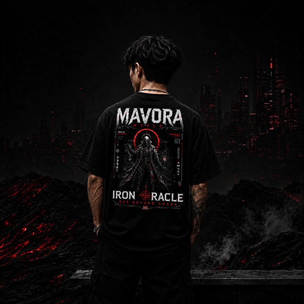 Person wearing a black t-shirt with 'Mavora' and 'Iron Oracle' design, standing in a dark, apocalyptic landscape.