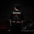 Person wearing a black t-shirt with 'Mavora' and 'Iron Oracle' design, standing in a dark, apocalyptic landscape.