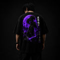 Person wearing a black t-shirt with a purple graphic design on the back against a dark background