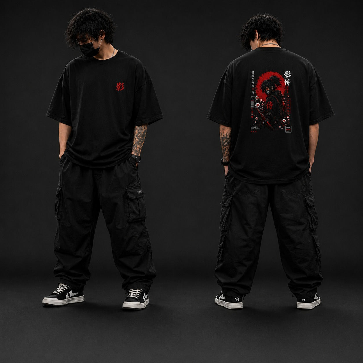 Person wearing a black t-shirt with a design on the front and back, standing against a dark background.
