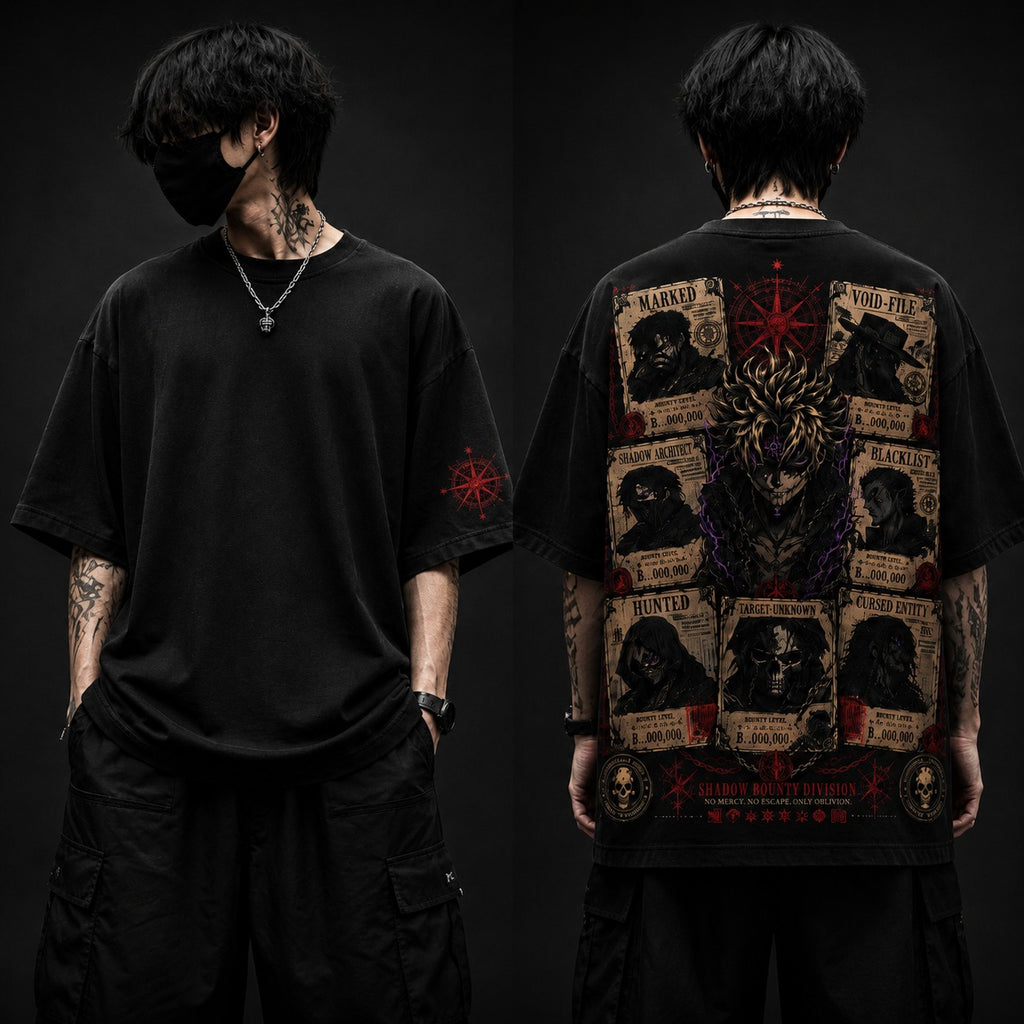 Person wearing a black t-shirt with intricate designs on the front and back against a dark background