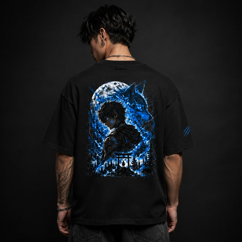 Person wearing a black t-shirt with a blue and white graphic on the back against a dark background