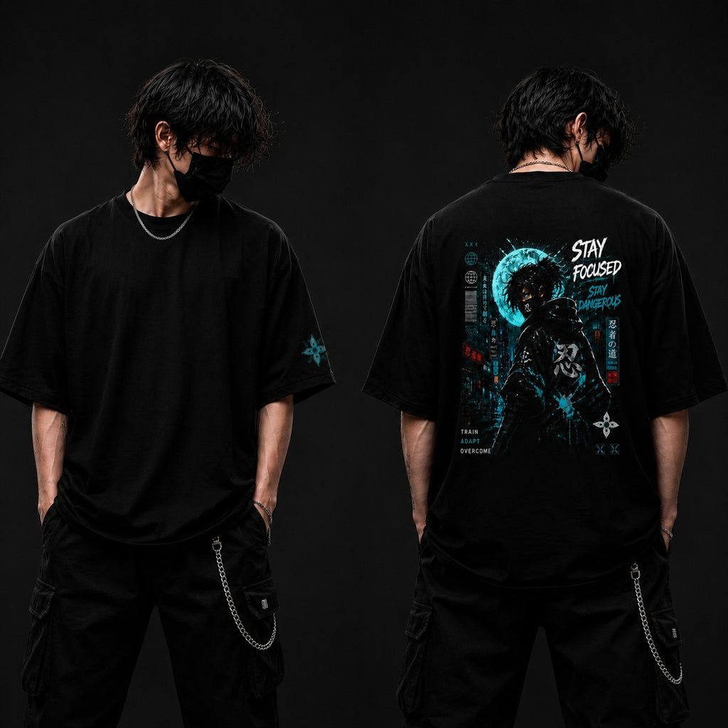 Person wearing a black t-shirt with a graphic design on the back, standing against a dark background.