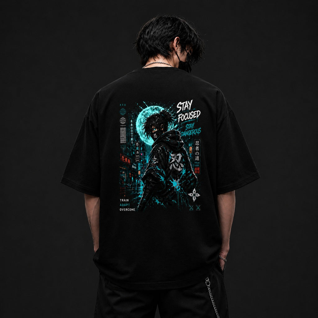 Person wearing a black t-shirt with a graphic design on the back against a dark background