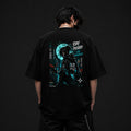 Person wearing a black t-shirt with a graphic design on the back against a dark background