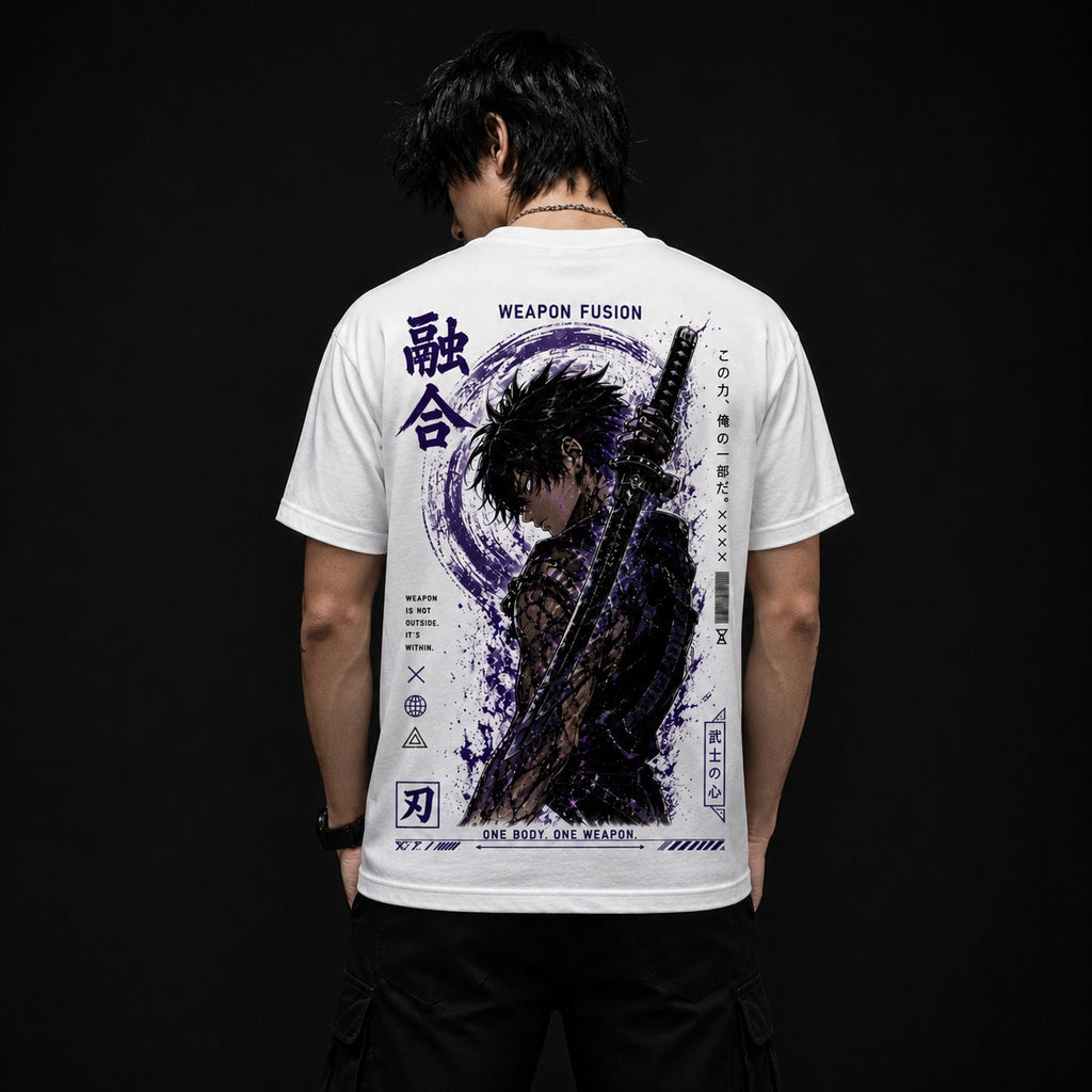 A man viewed from behind wearing a white short-sleeve T-shirt with a large dark graphic print on the back, paired with black pants against a black background.