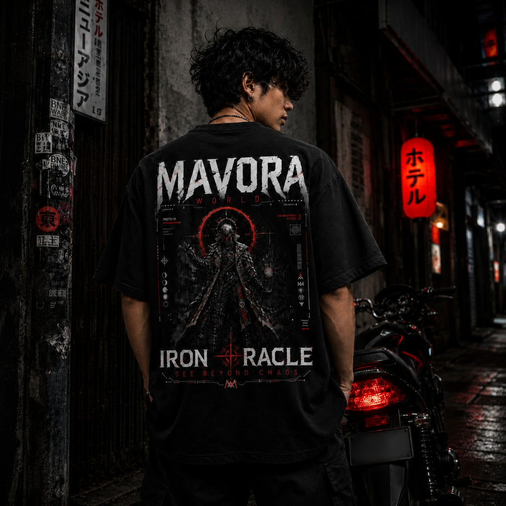 Person wearing a black t-shirt with 'MAVORA' and 'IRON RACLE' branding in an urban setting.
