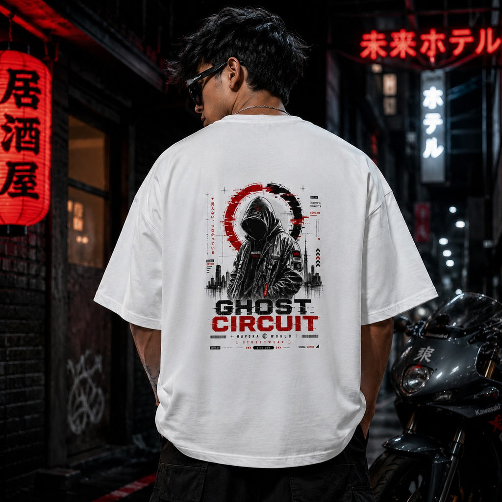Person wearing a white t-shirt with 'Ghost Circuit' design in an urban setting