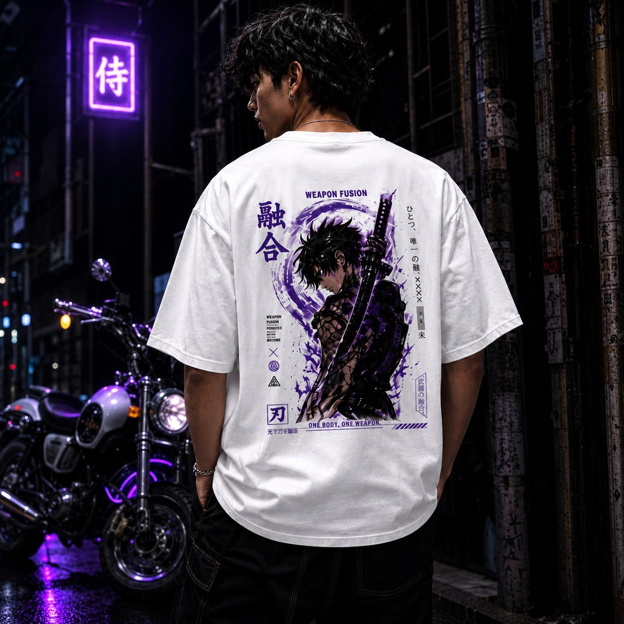 Person wearing a white t-shirt with a graphic design and text, standing in an urban night setting.